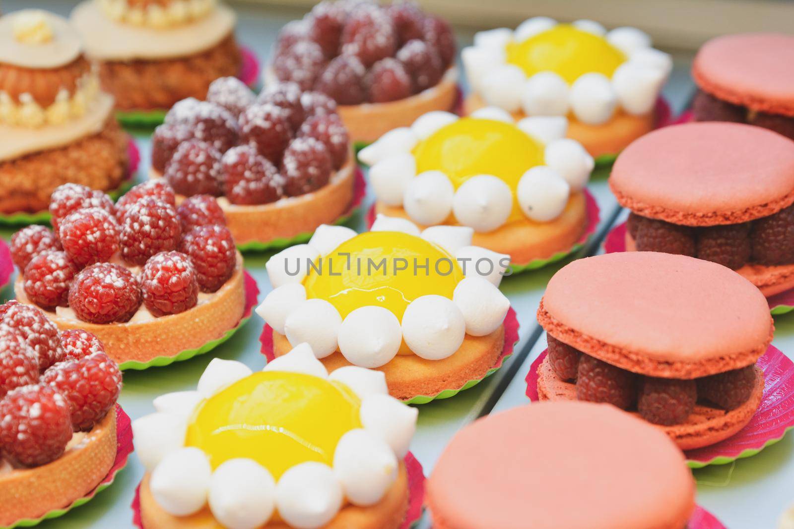 Raspberry macaroons and tarte of lemon. Pie.