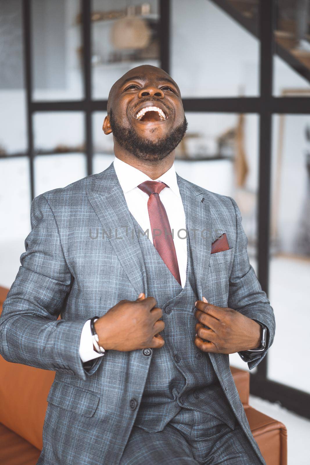 Gesture Of Super Satisfied With His Life Man. Luxurious Afro American Laughs From The Heart And Is Pleased With What Is Happening. High quality photo