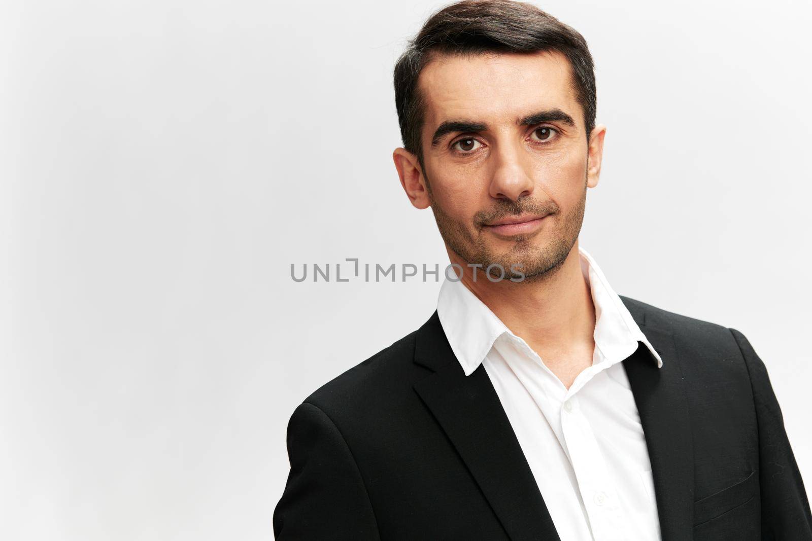 handsome man black suit close-up emotions isolated background. High quality photo