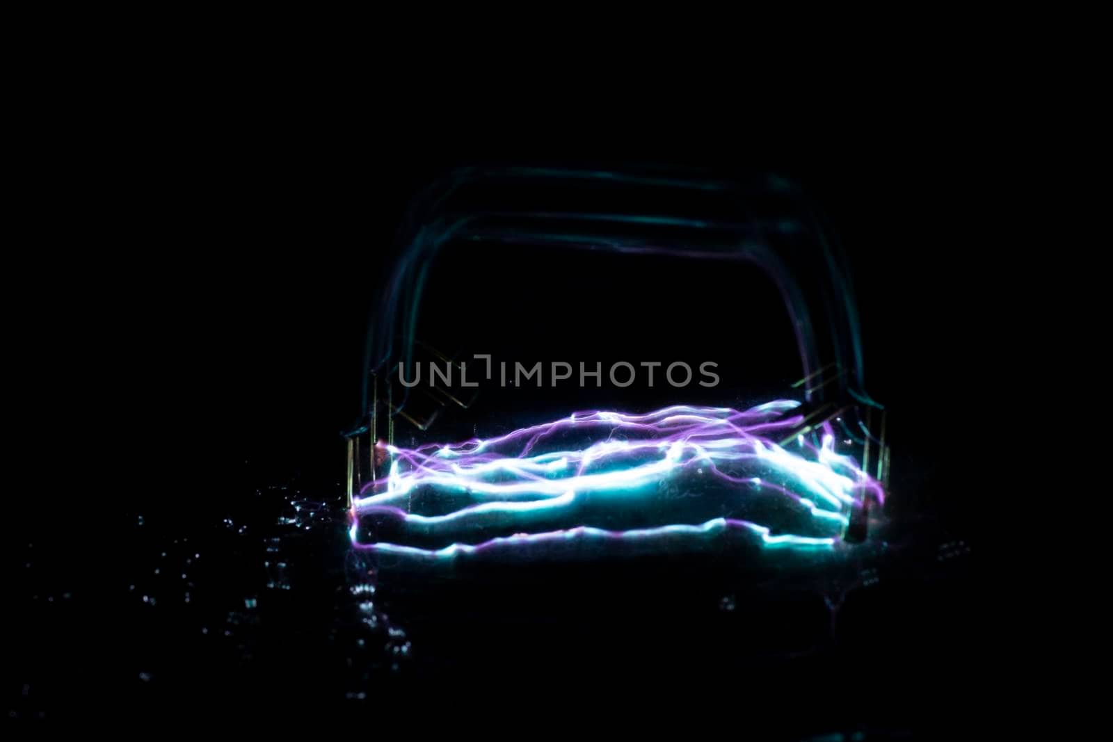 blue and purple taser electric discharge on black. High quality photo