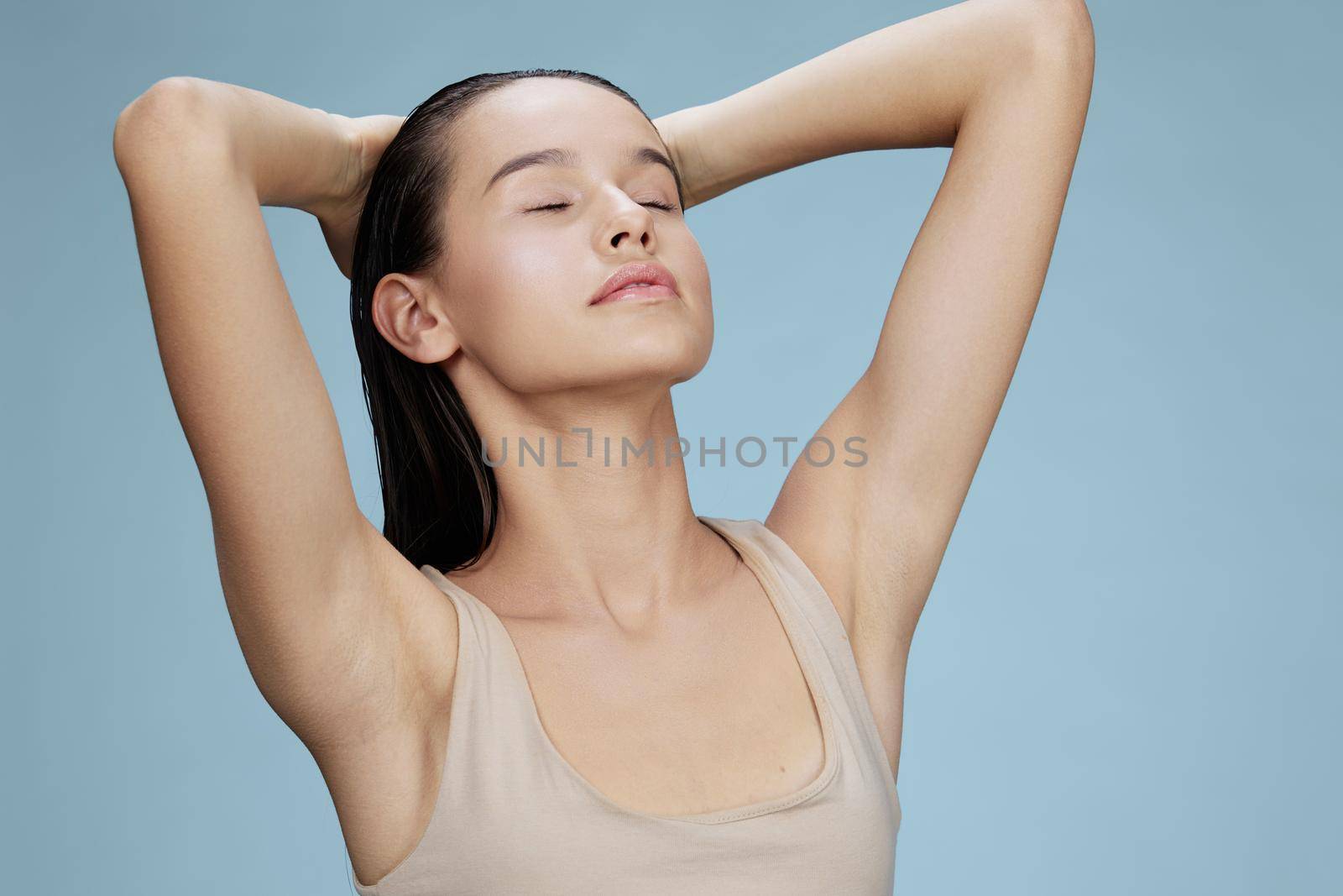 woman touches the face skin care charm posing studio isolated background. High quality photo