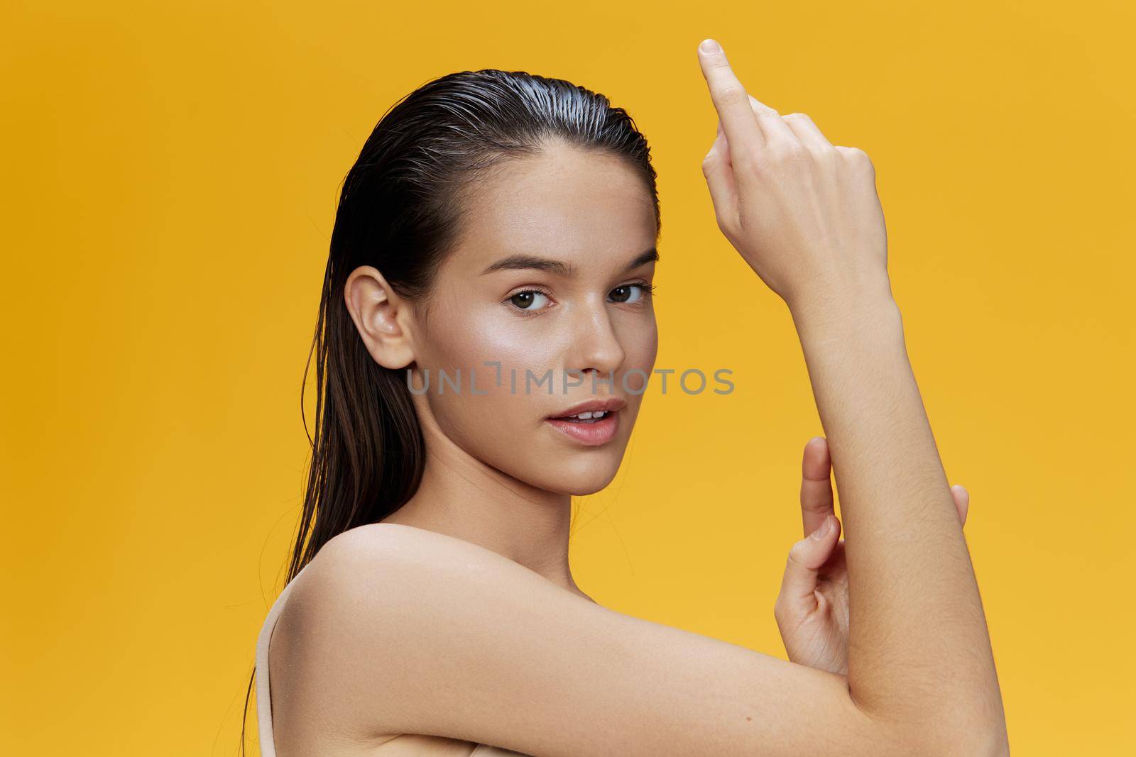 beautiful woman posing holding hand near face isolated background. High quality photo