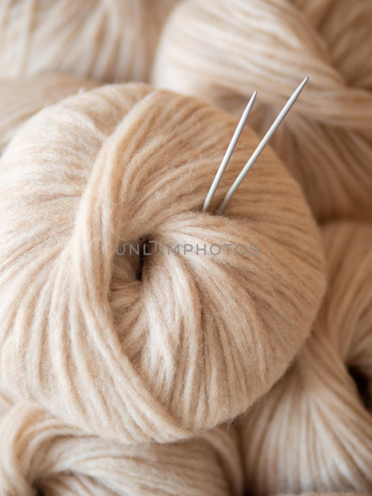 Aesthetic beige yarn skein, close up by fascinadora