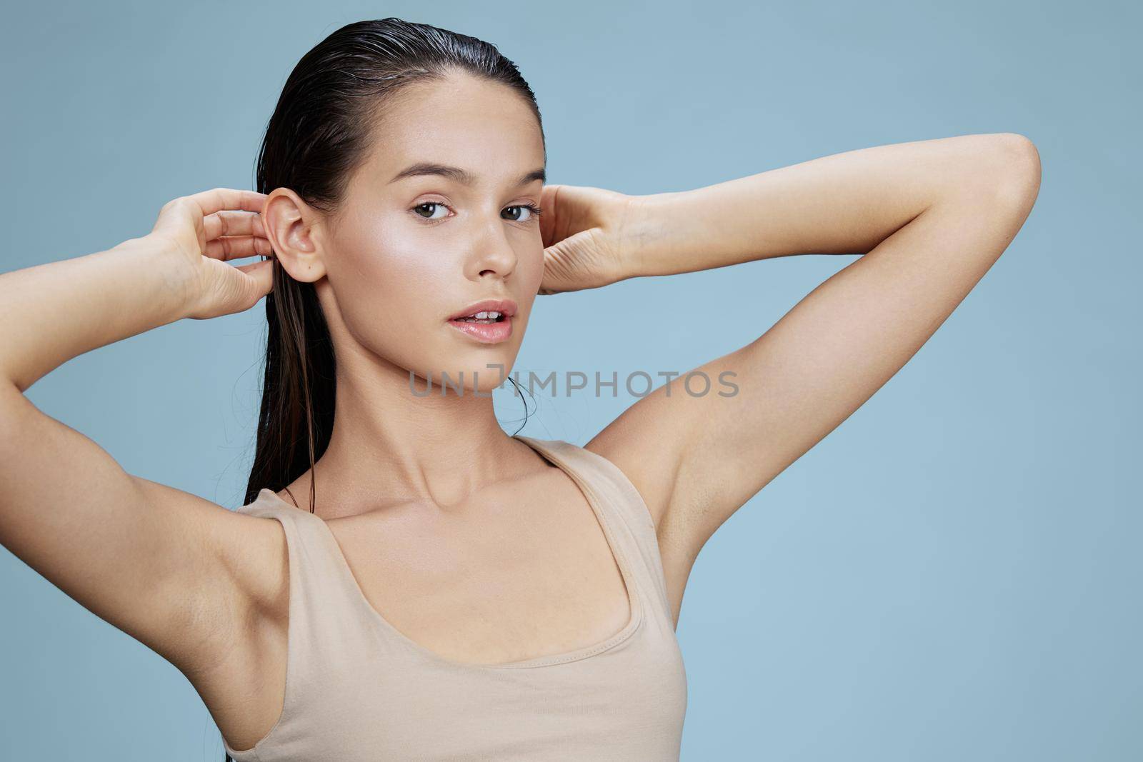 portrait woman face cosmetics clean skin tenderness blue background by SHOTPRIME