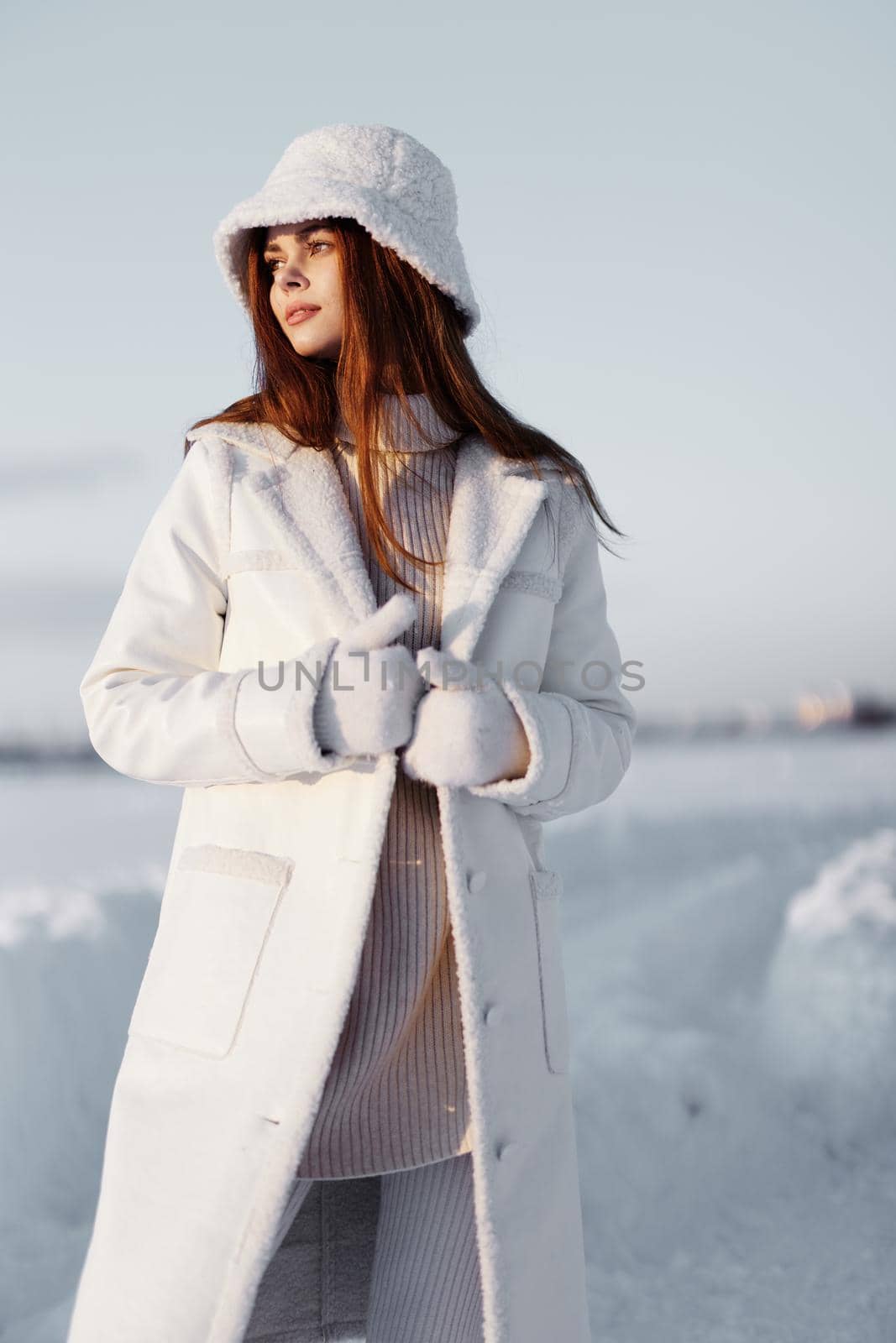 woman red hair snow field winter clothes nature. High quality photo