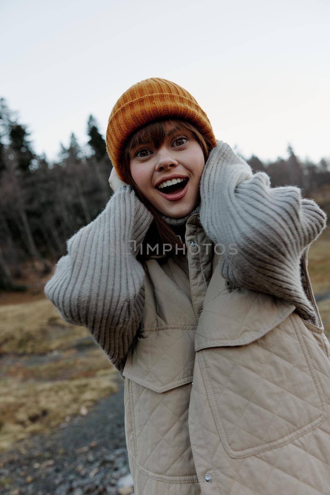 young woman in the autumn forest walk fresh air travel life style. High quality photo