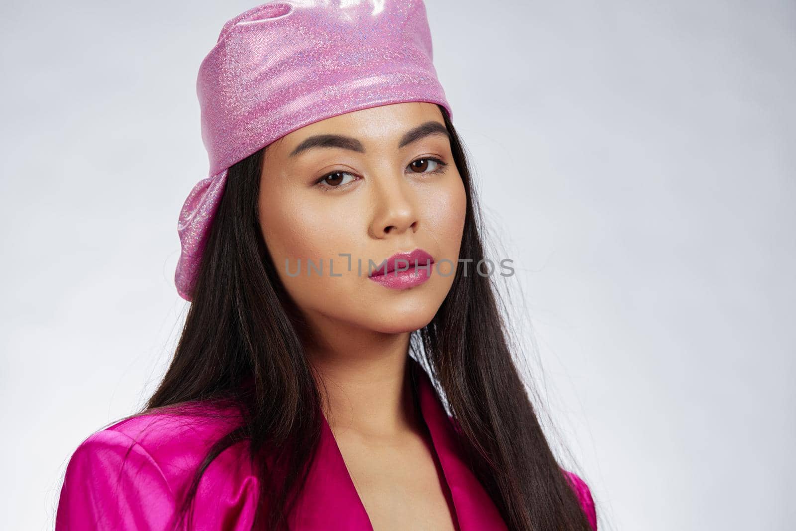 young woman posing pink mini dress charm headscarf Gray background. High quality photo