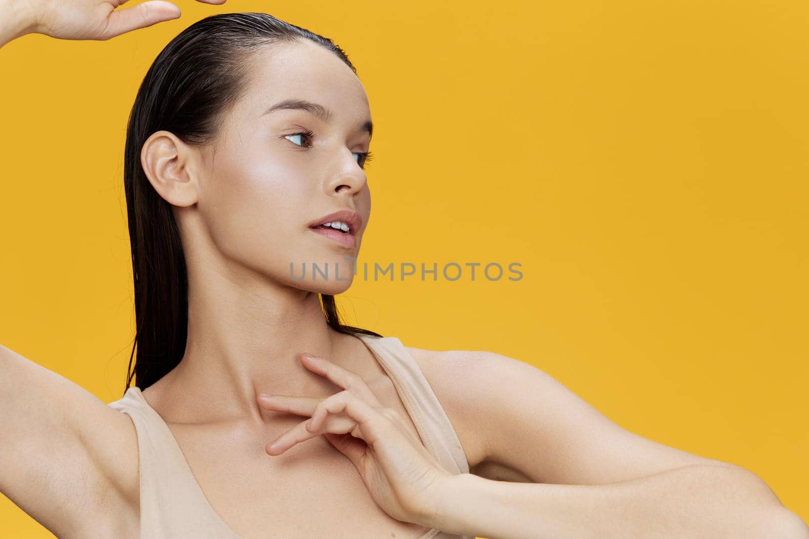 woman clean skin health attractive look cosmetology yellow background. High quality photo