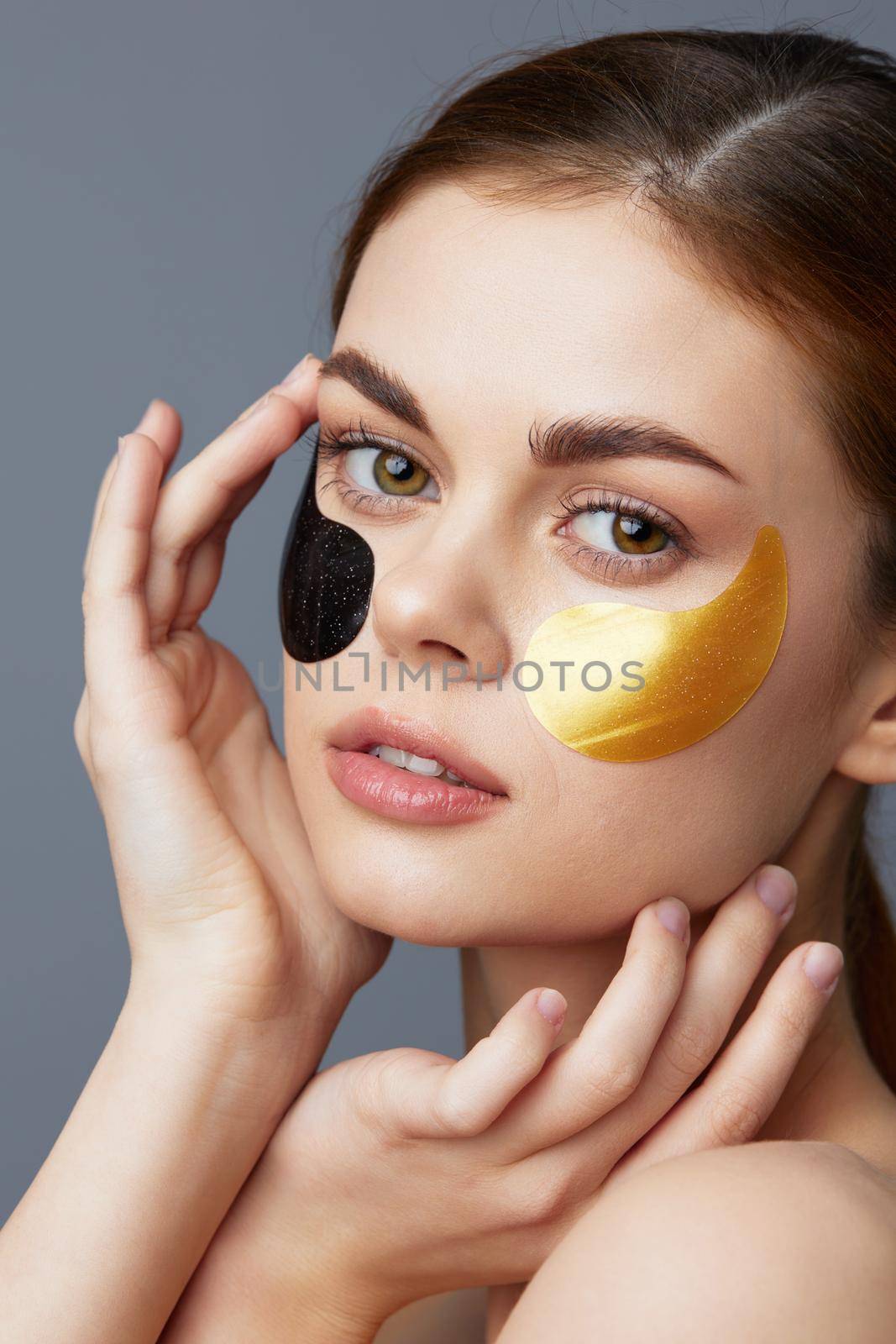 beautiful woman multicolored patches rejuvenation skin care fun close-up Lifestyle. High quality photo