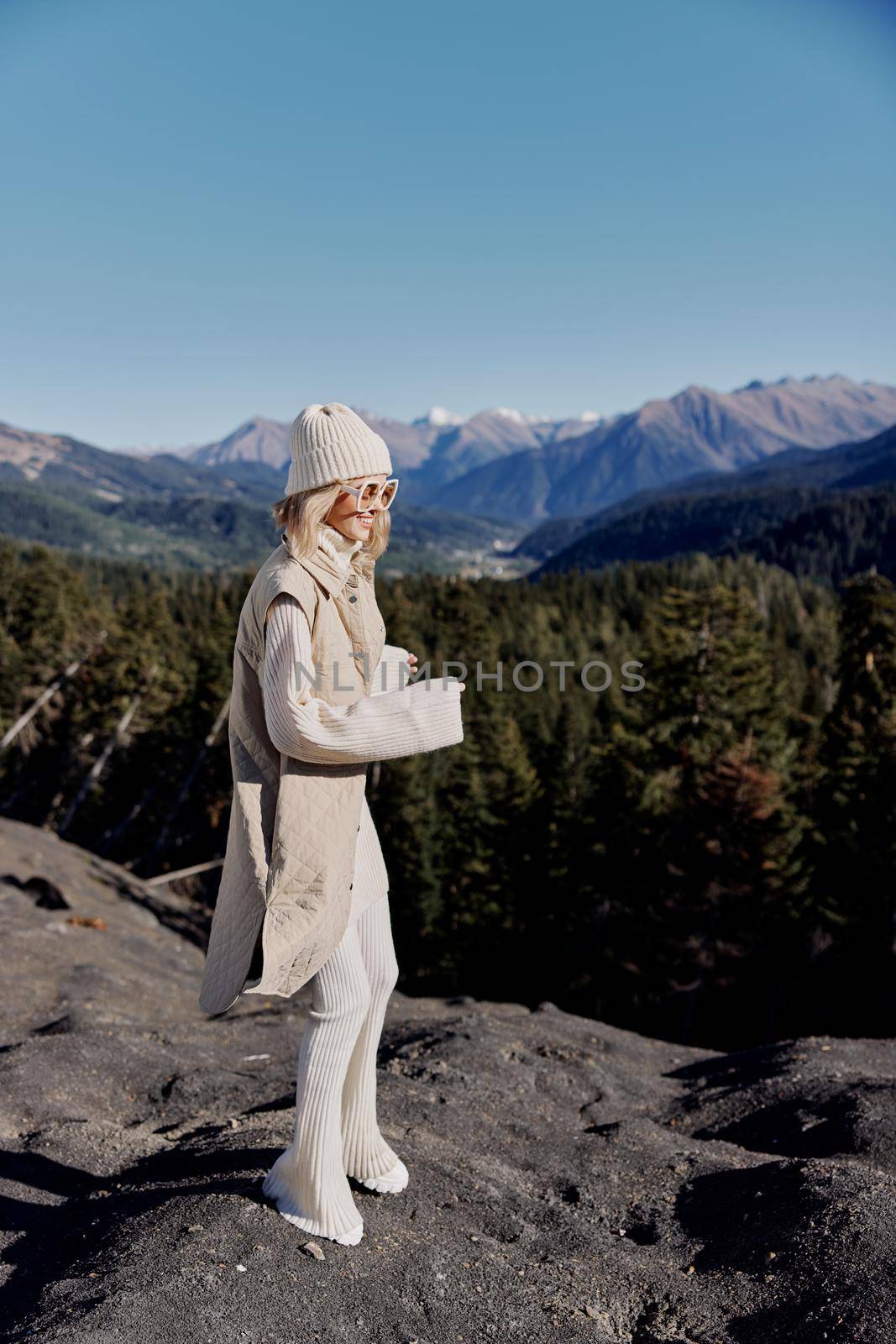 woman standing on the top of the mountain forest lifestyle by SHOTPRIME