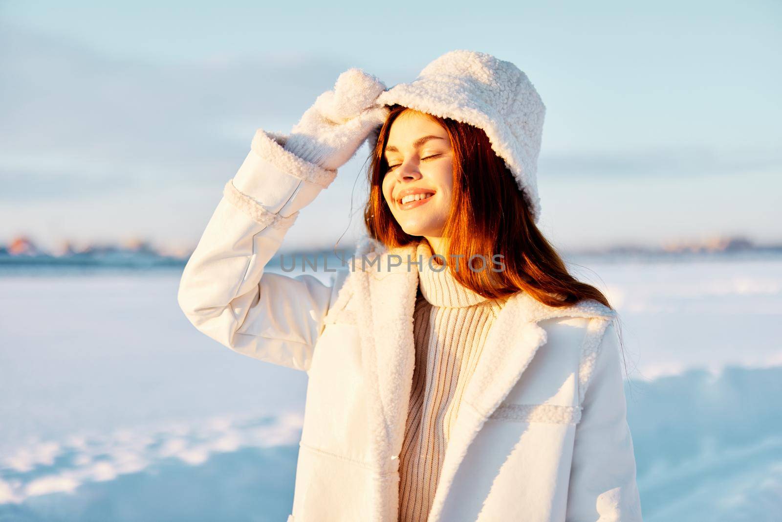 beautiful woman red hair snow field winter clothes Fresh air. High quality photo