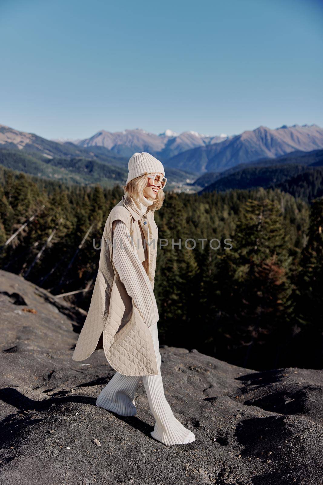 woman fashion glasses mountain top nature freedom relaxation. High quality photo