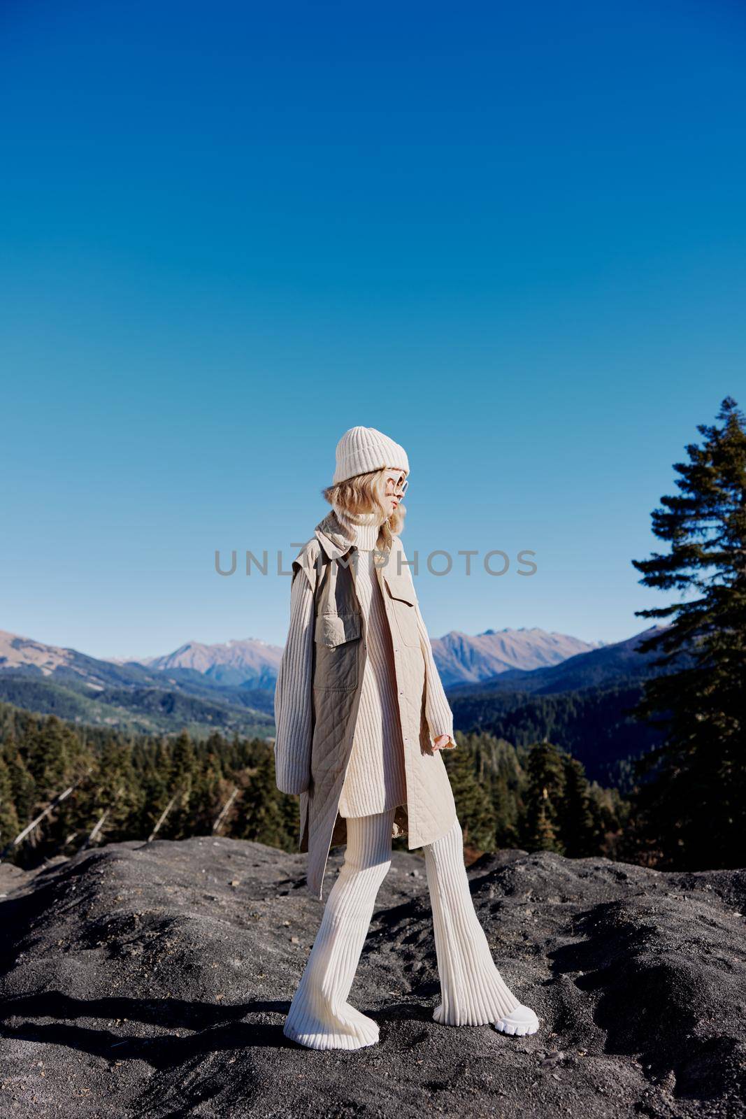 young woman fashion glasses mountain top nature freedom lifestyle by SHOTPRIME
