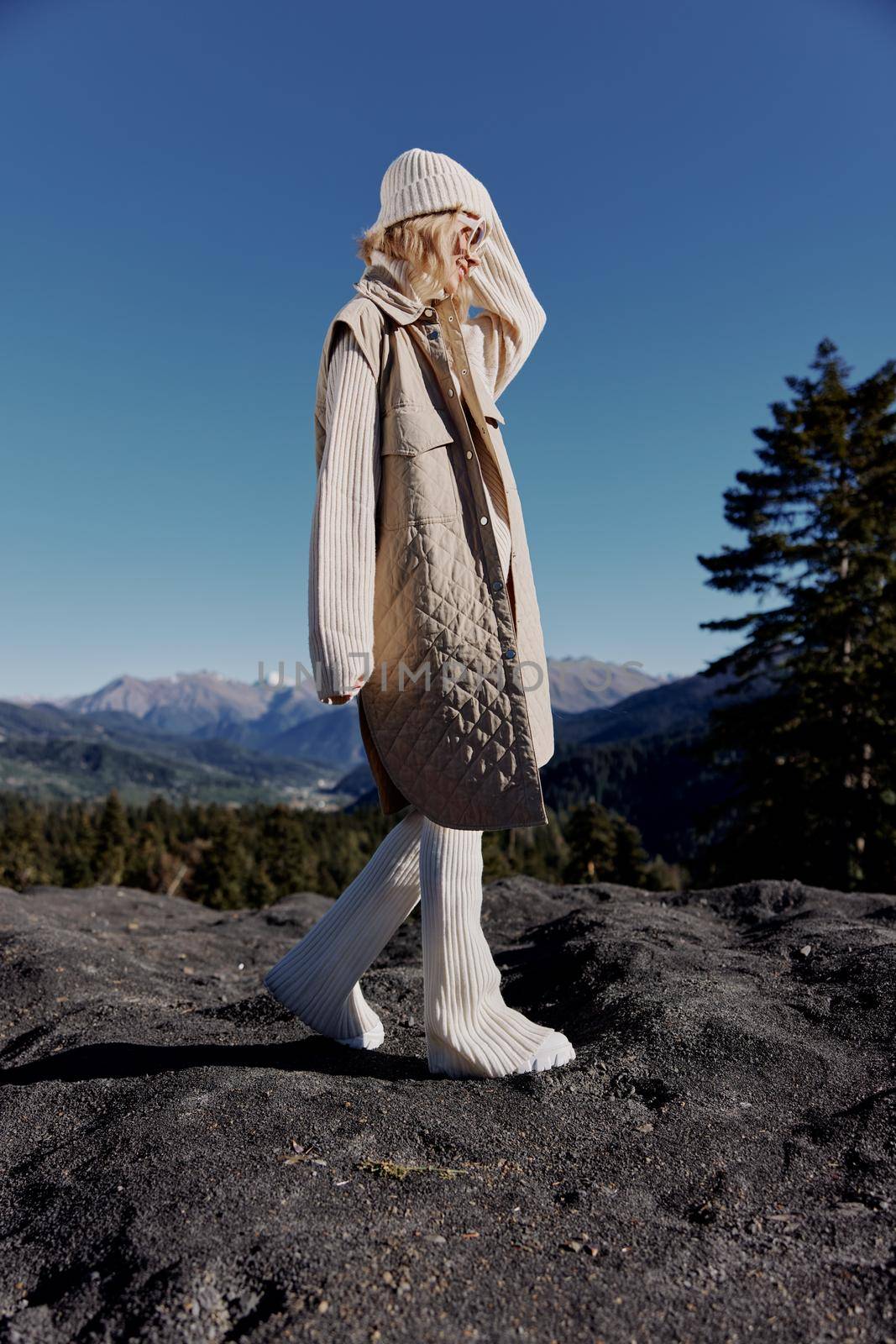 woman Cliffs mountains fashion posing nature fresh air landscape. High quality photo