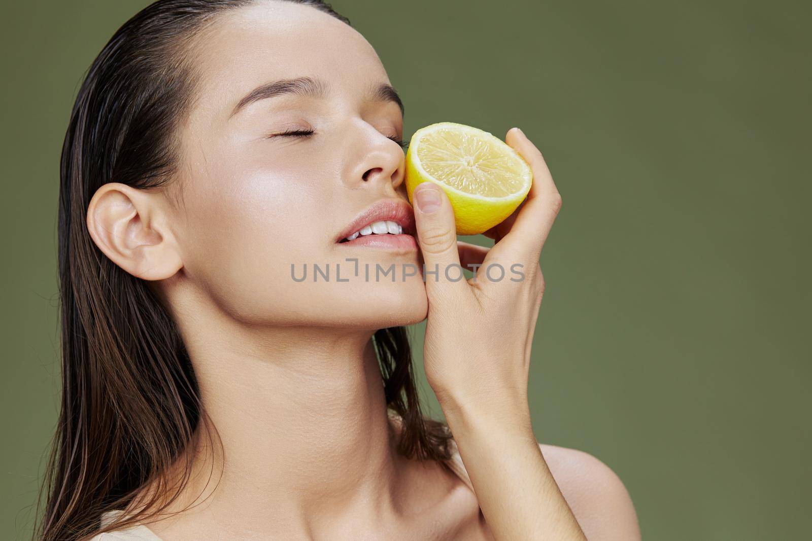 brunette with lemon near face clean skin care health isolated background by SHOTPRIME