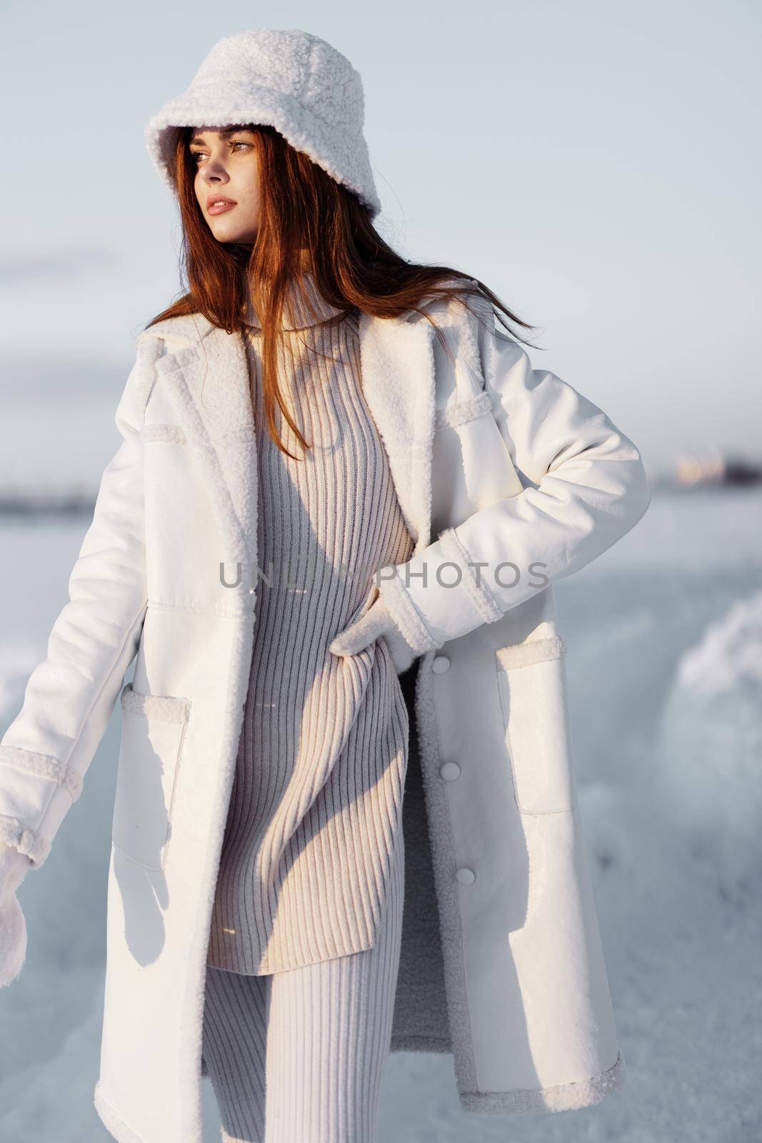 beautiful woman red hair snow field winter clothes travel. High quality photo