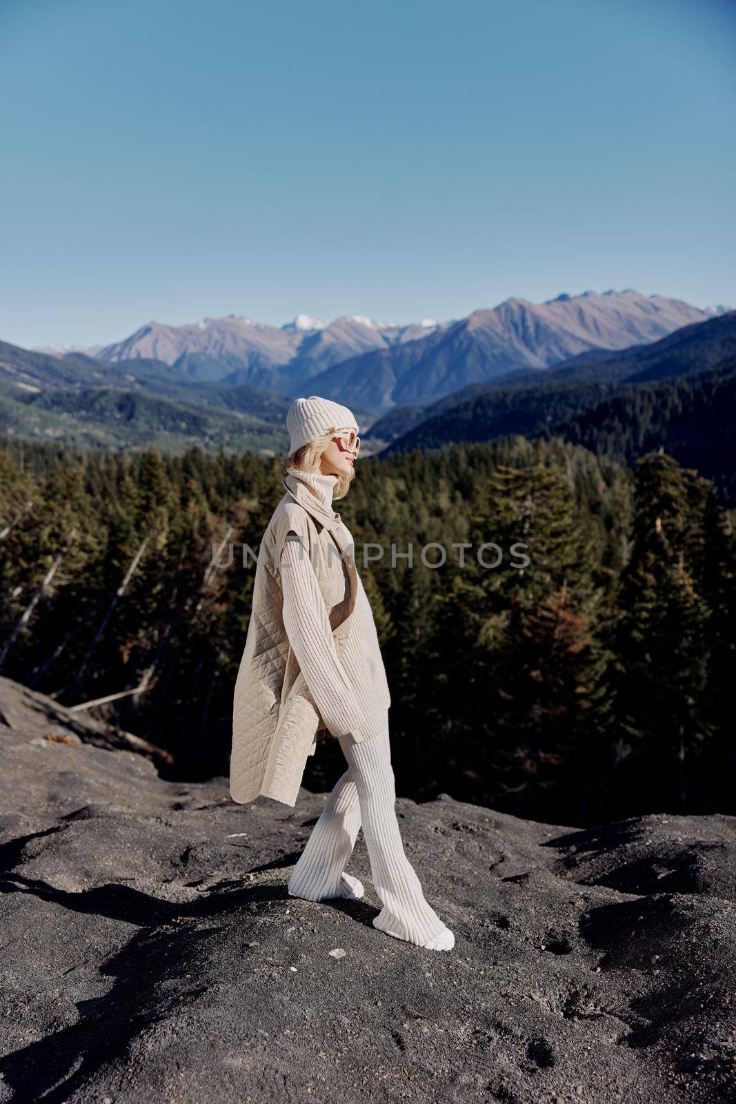 woman standing on the top of the mountain forest lifestyle. High quality photo