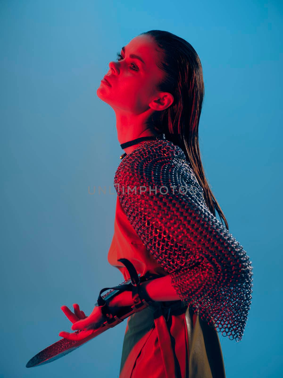 cyberpunk photo pretty woman in dress arm in armor chain mail protection blue background by SHOTPRIME
