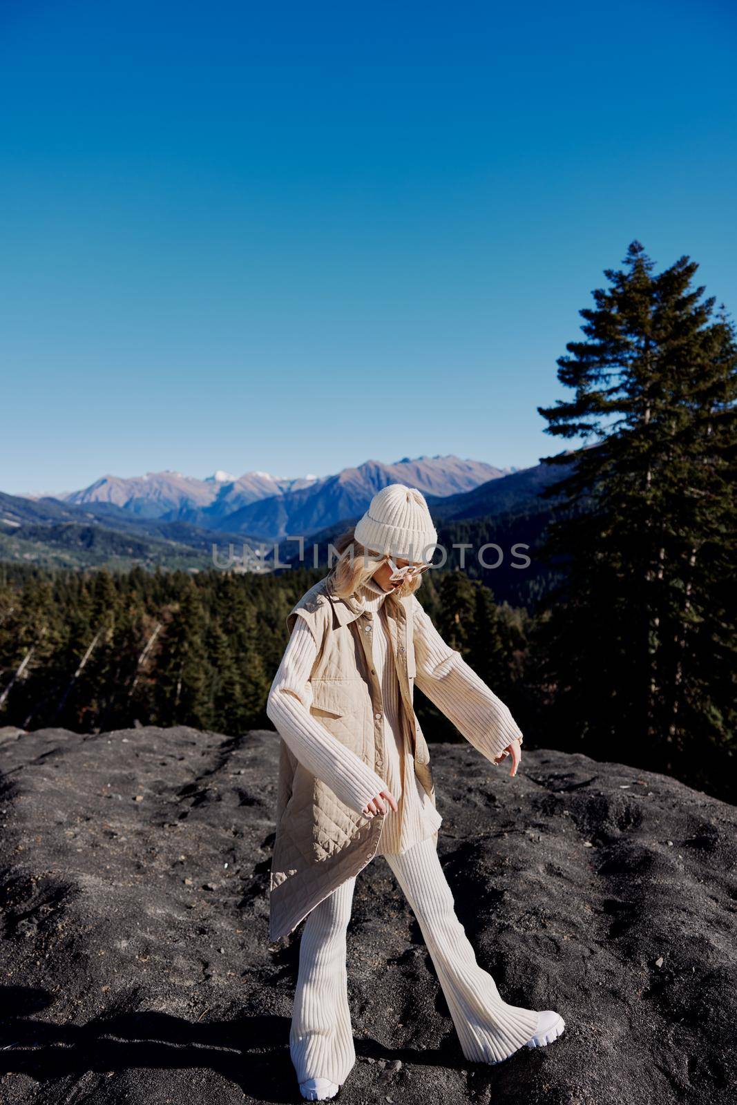 young woman standing on the top of the mountain forest landscape by SHOTPRIME
