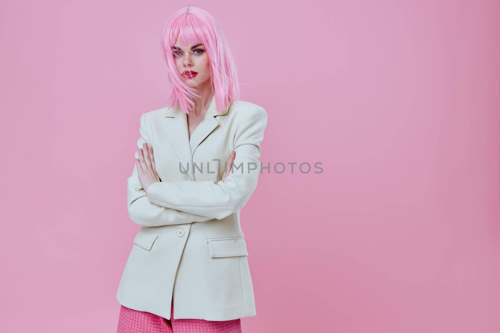 Pretty young female attractive look white blazer pink wig color background unaltered. High quality photo