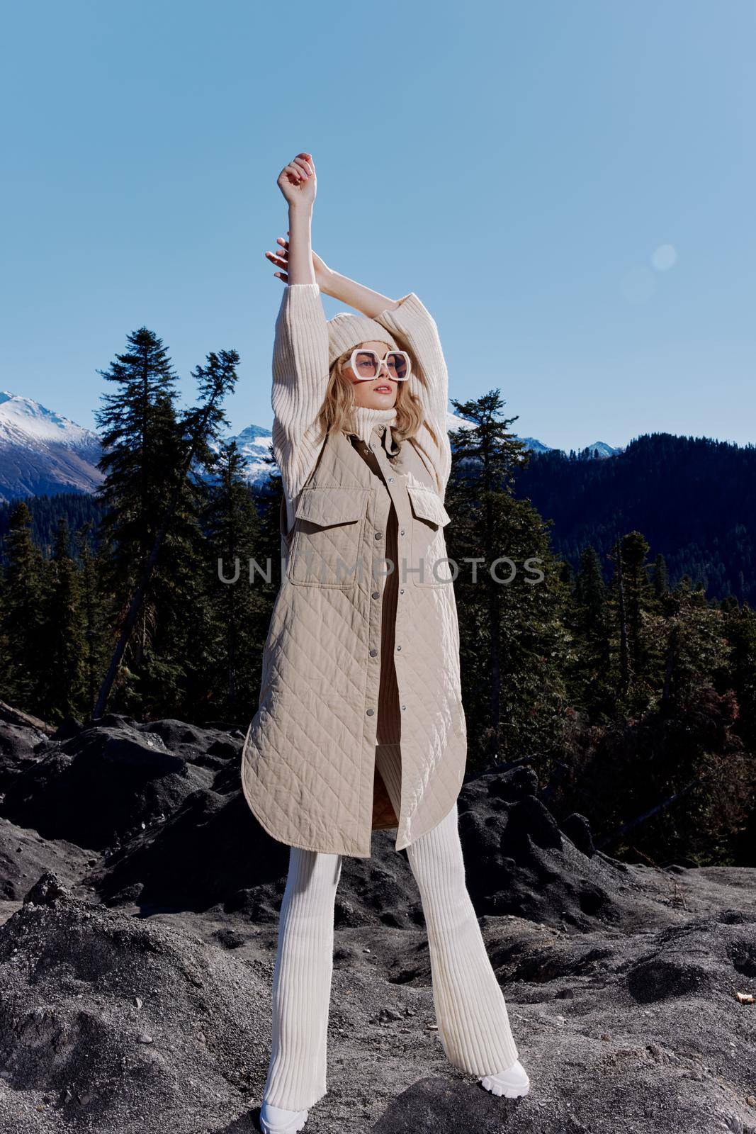 Stylish woman nature autumn style travel to the mountains relaxation. High quality photo