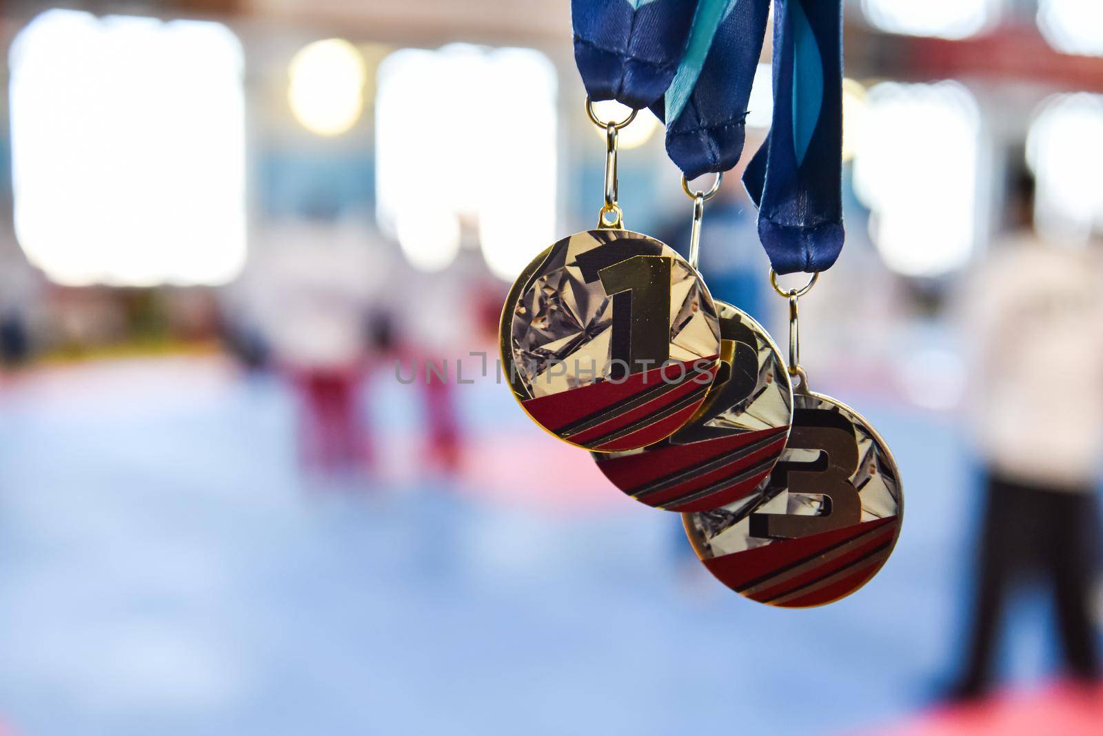 medals, gold, silver, and bronze on a blurred background with copy space by karpovkottt