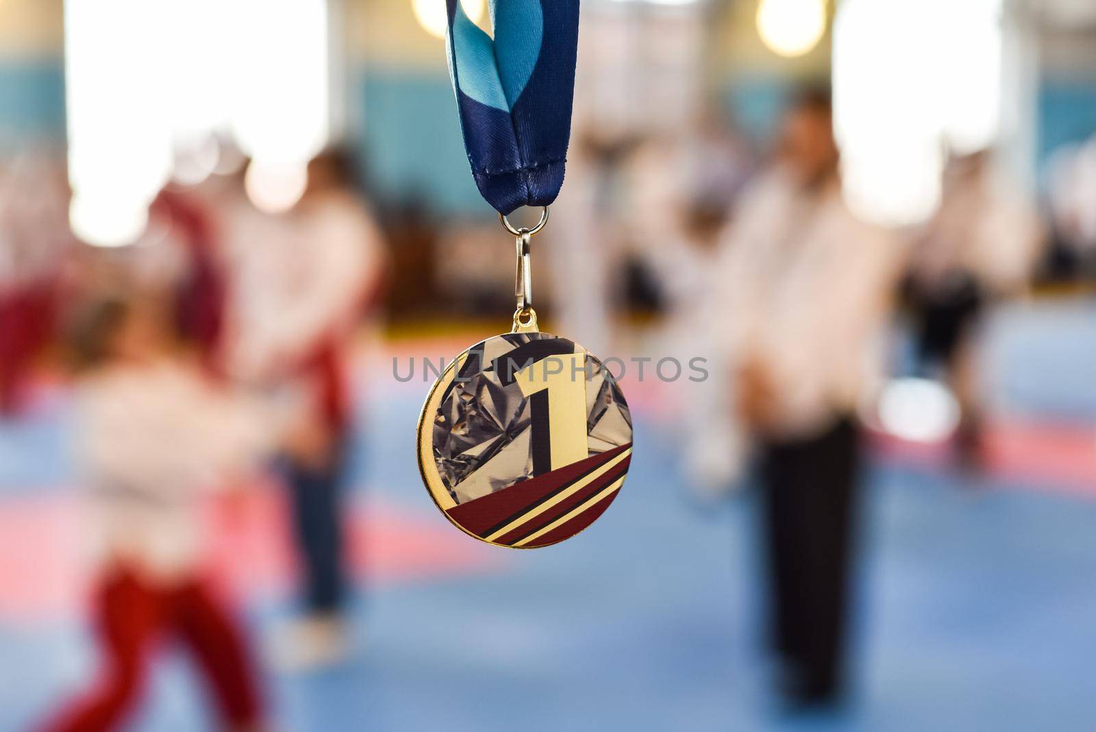 gold medal on a blurred background. medal for first place in a competition.