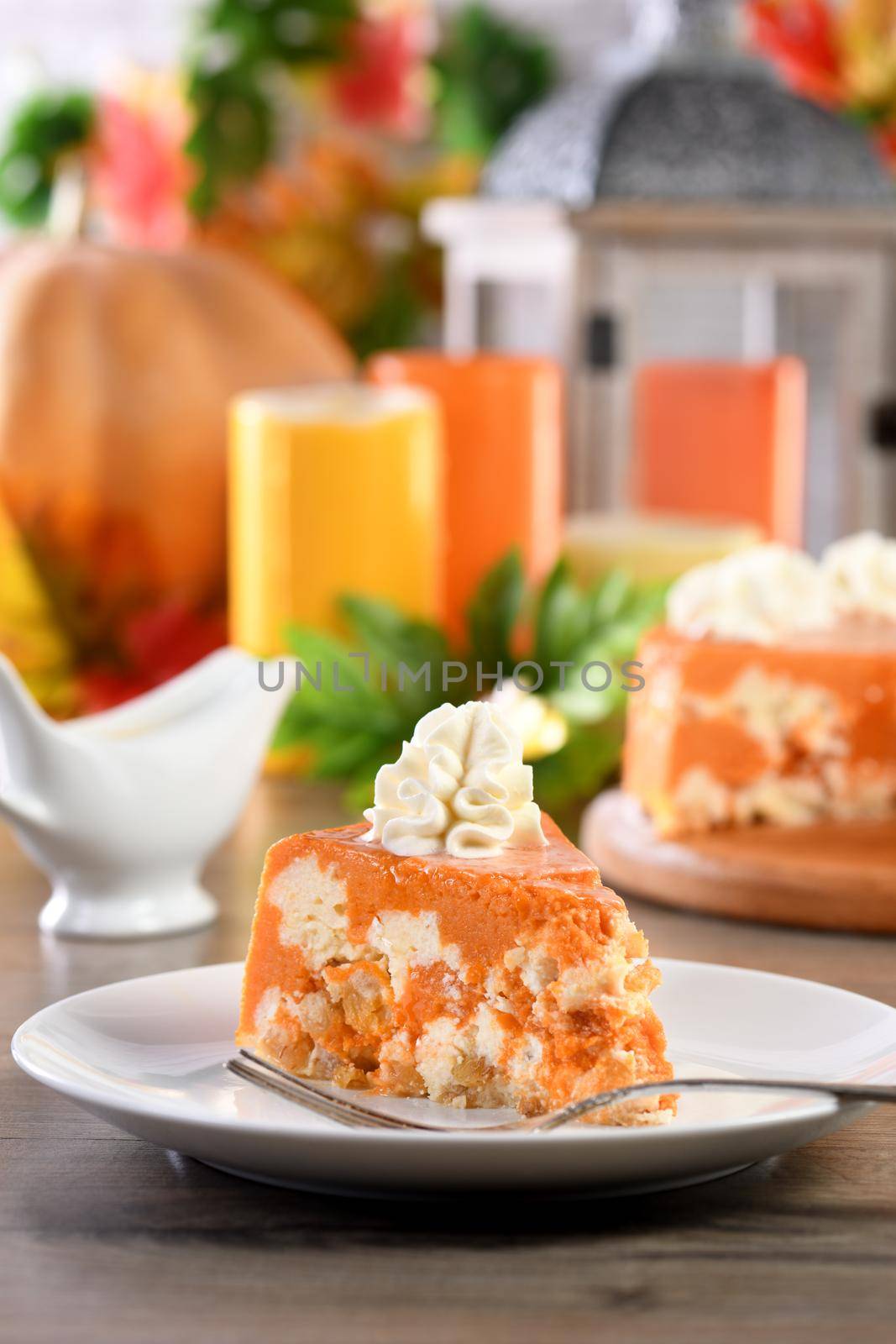 Slice of Pumpkin and cottage cheese casserole on a plate. This is a delicious dessert filled with autumnal notes. It is full of pumpkin spice aromas, creamy softness with raisins.