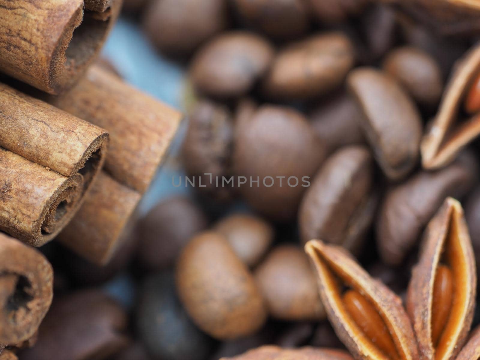 coffee cinnamon and star anise on gray background close up