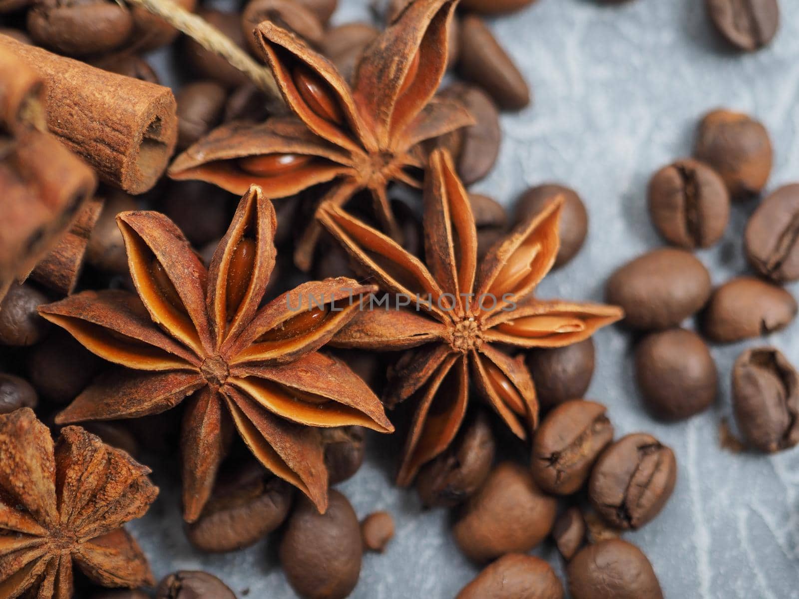 coffee cinnamon and star anise on gray background close up