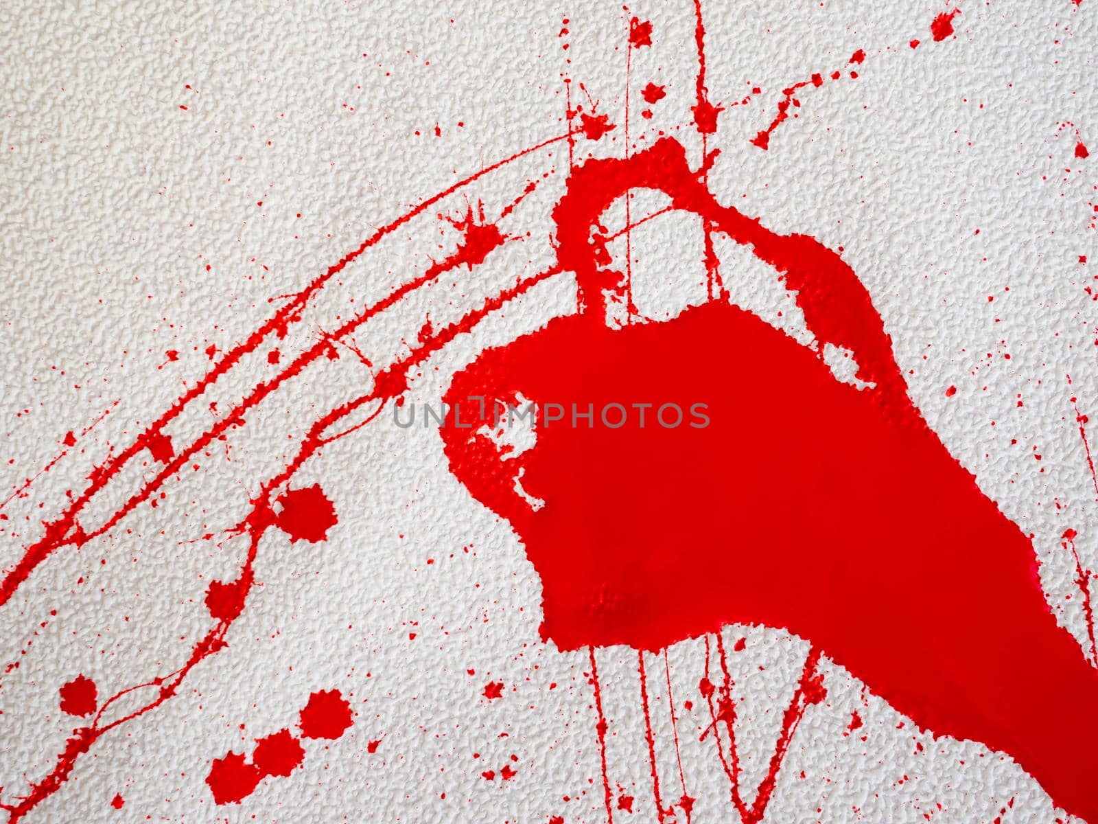 red blot and splashes of paint on a white background. expressionism