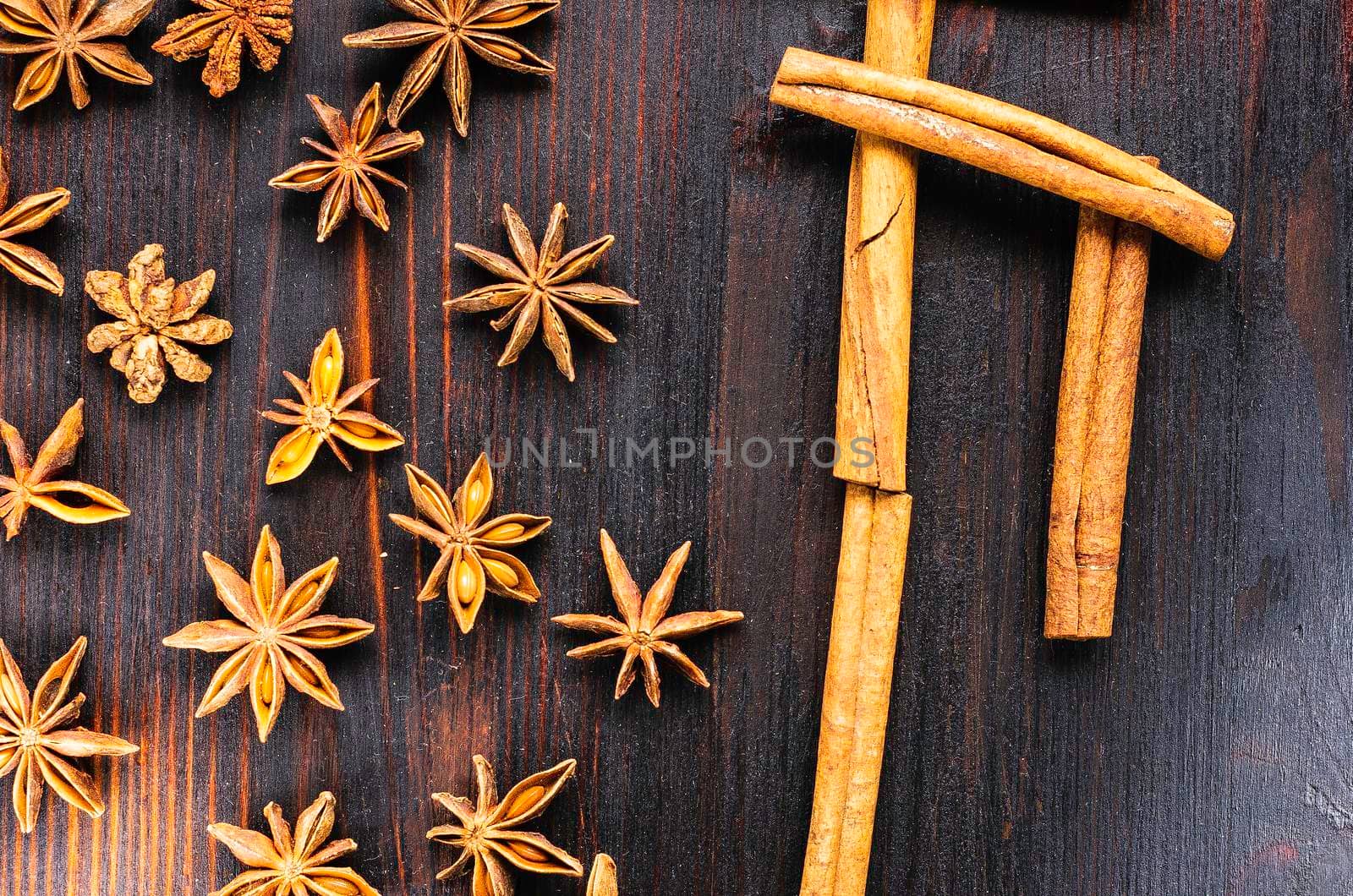 scattered the cinnamon and star anise top view left and right on desk