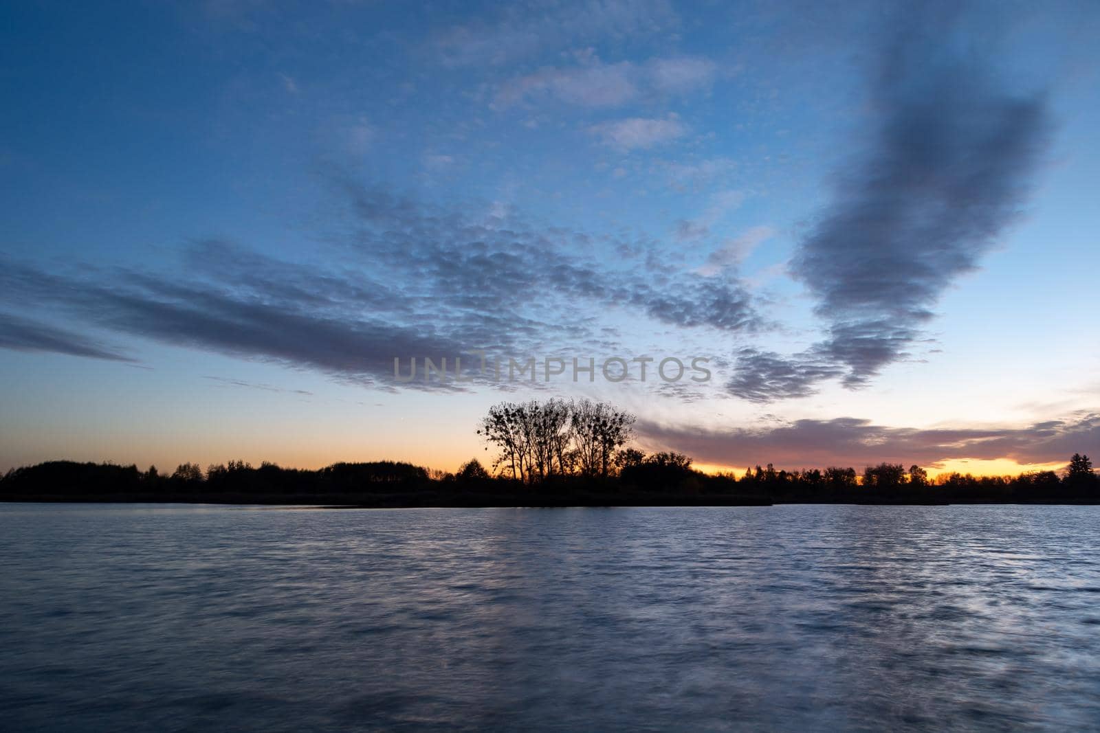 Small clouds after sunset on the lake, Stankow, Poland