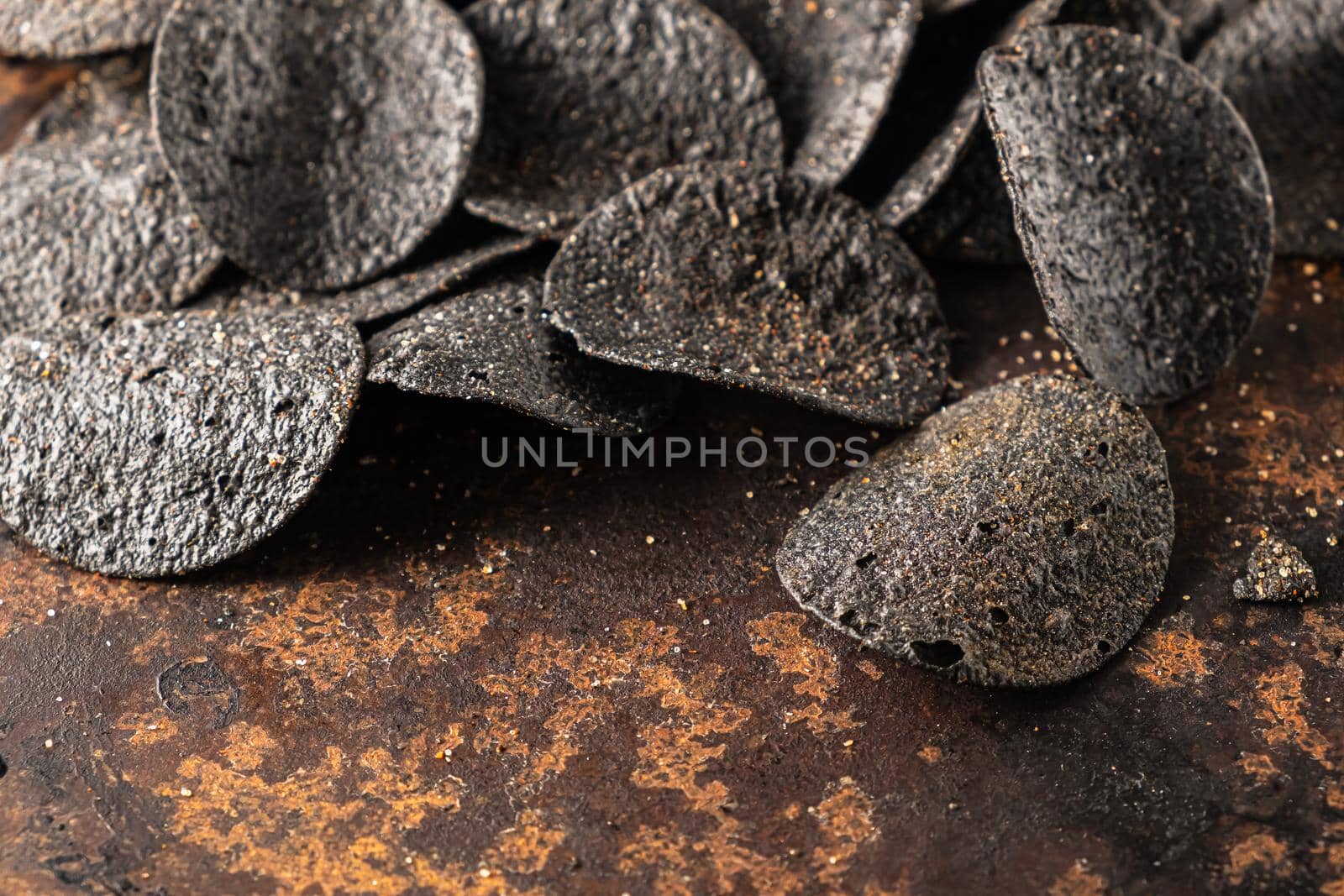 background of many black chips with spices by Alexander_V
