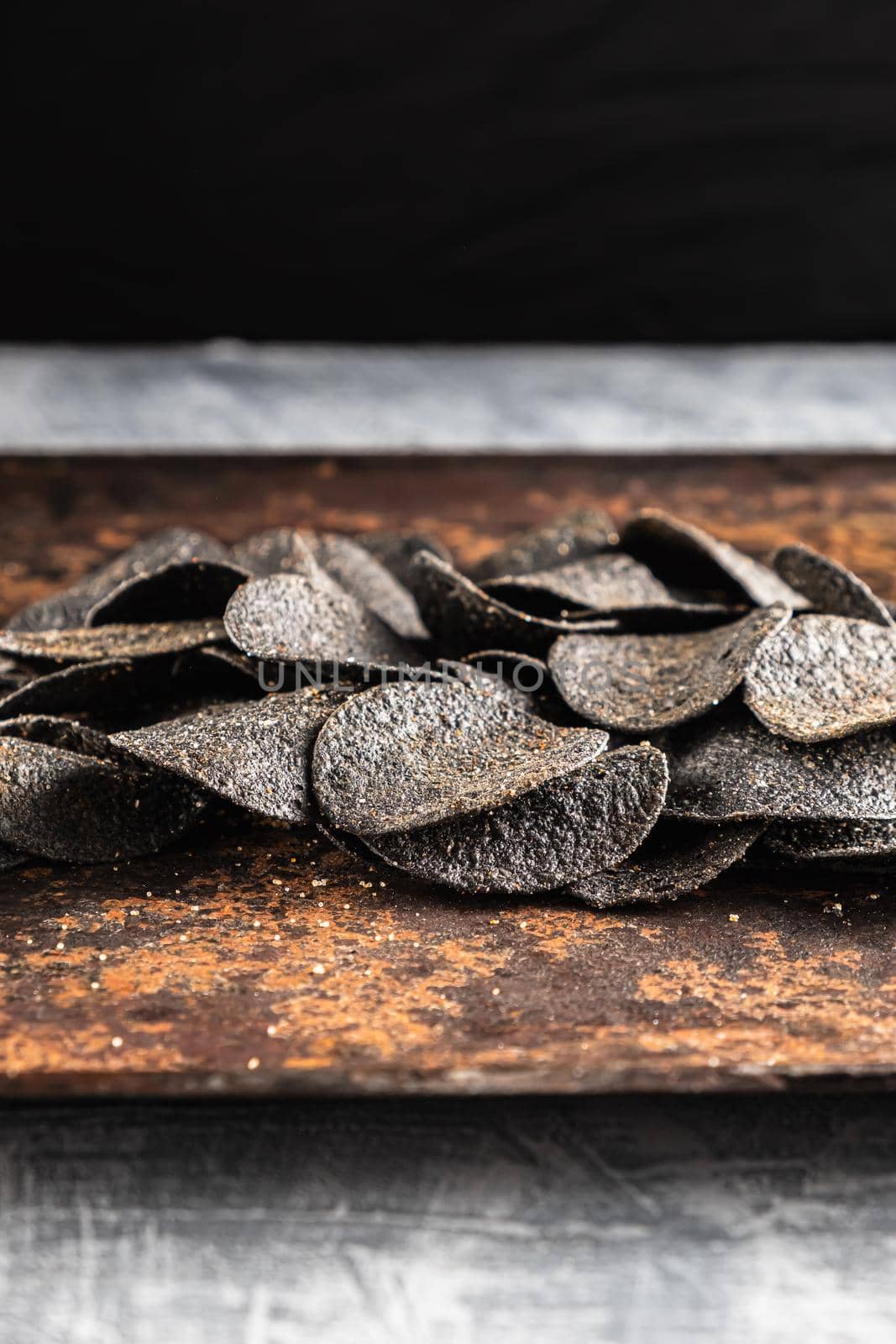 background of many black chips with spices by Alexander_V