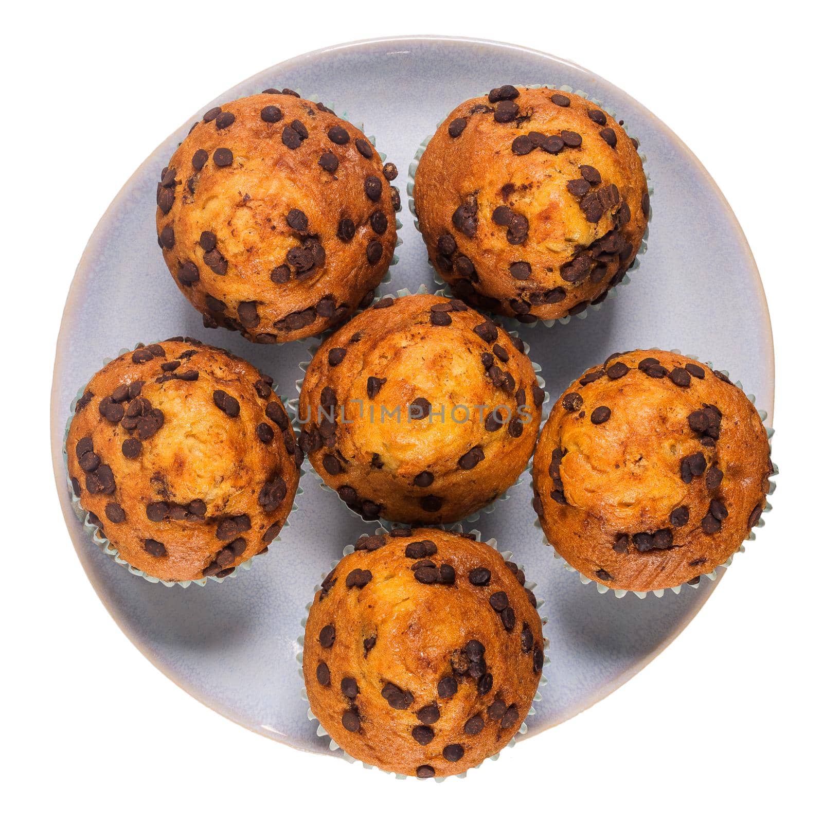 Muffins with chocolate chips on a ceramic plate by homydesign
