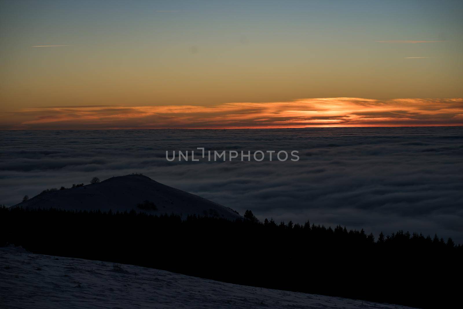 the romance of tourism and recreation, as well as the principles of a healthy lifestyle, is to watch the fantastic play of the sun's rays setting over the horizon on the highest Wasserkuppe mountain in Hesse, Germany and breathe the fresh, clean mountain air by Costin