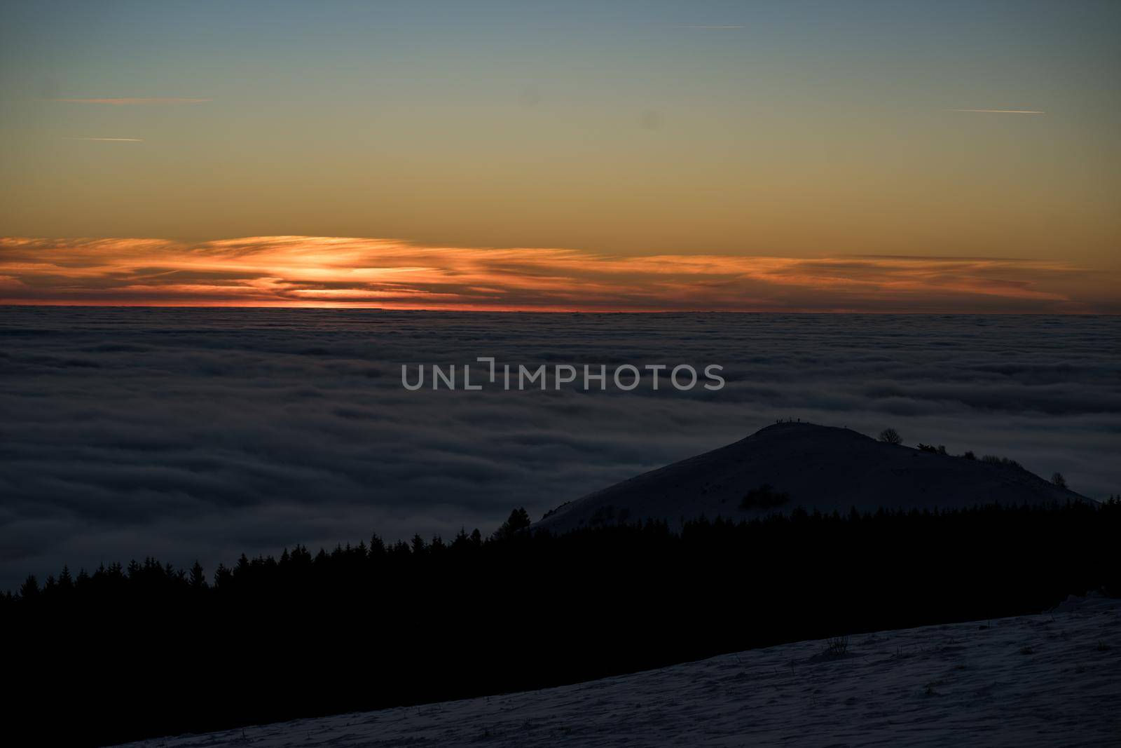 the romance of tourism and recreation, as well as the principles of a healthy lifestyle, is to watch the fantastic play of the sun's rays setting over the horizon on the highest Wasserkuppe mountain in Hesse, Germany and breathe the fresh, clean mountain air by Costin