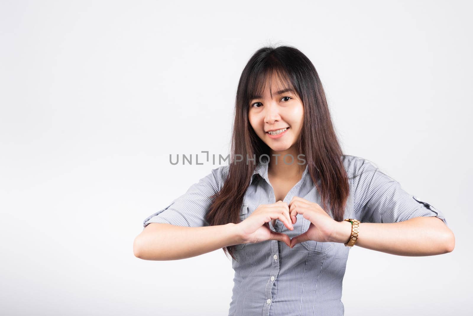 Woman smiling confidence make finger heart gesture figure symbol shape sign by Sorapop