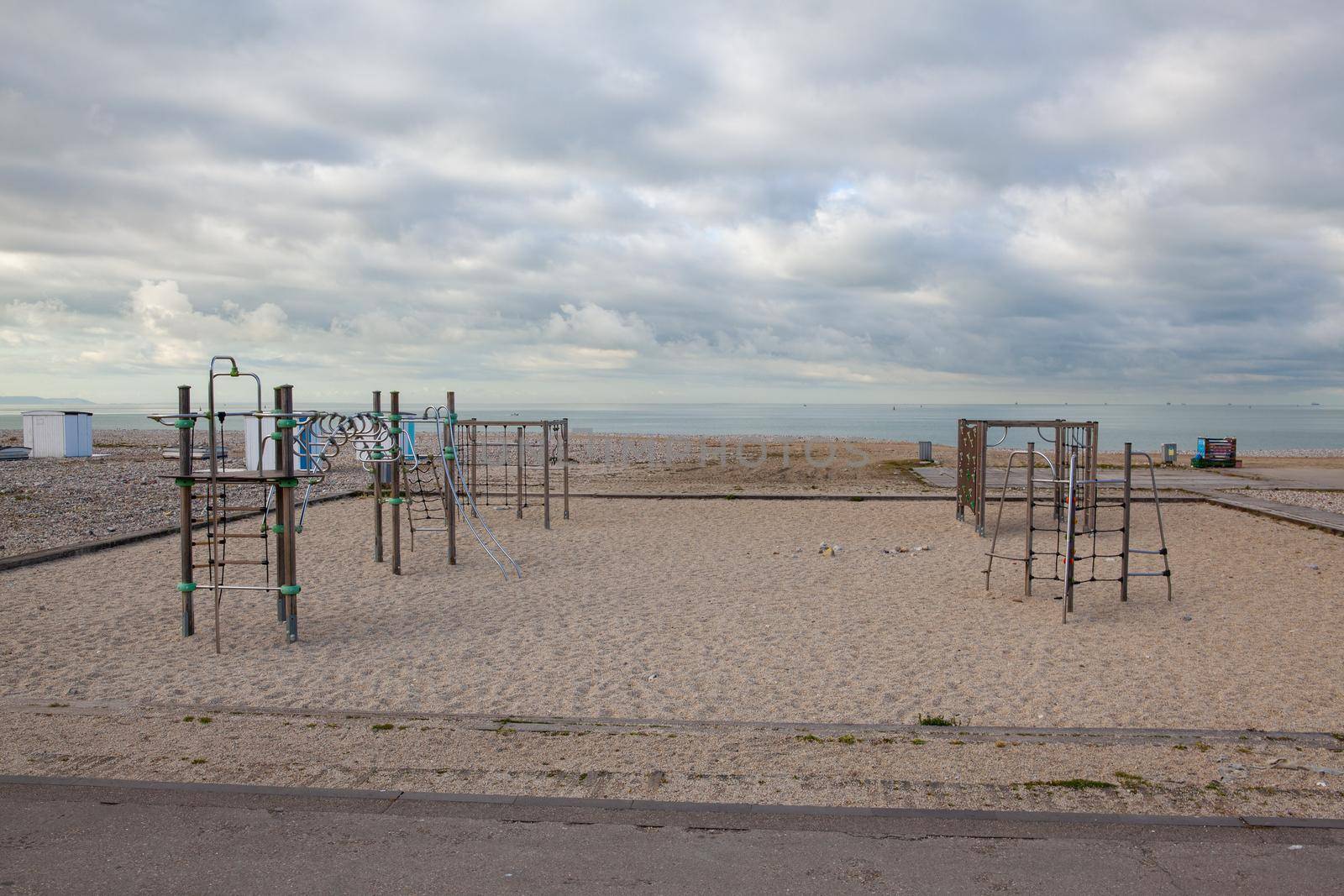 Empty playground on the beach, Le Havre, France. by CaptureLight
