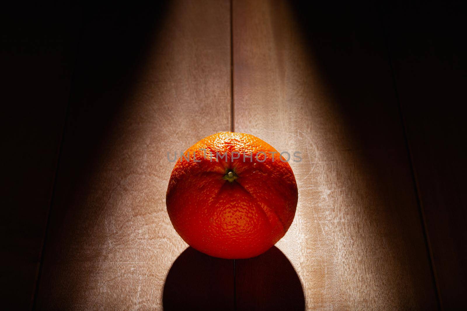 Orange fruit on the wooden table. Dark Food Photography.