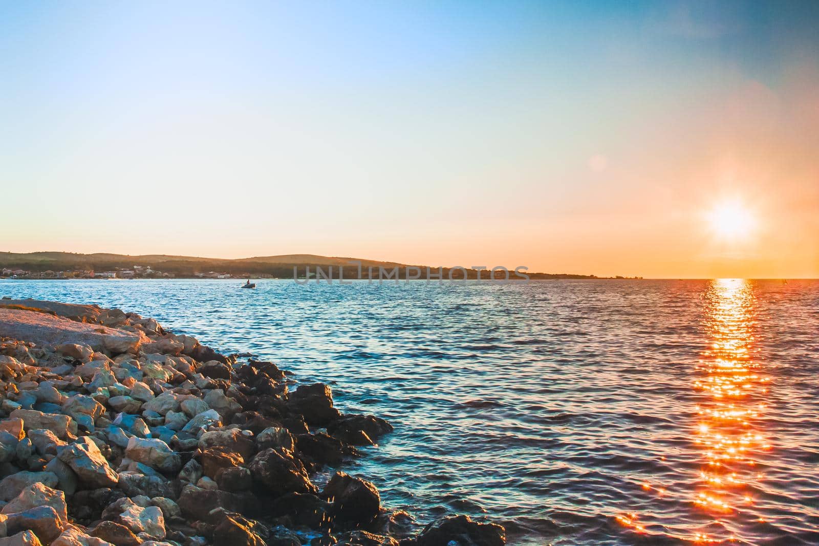 Rocky coastline and blue sky on island Vir, Croatia. Evening sunset with pastel colours of sky.