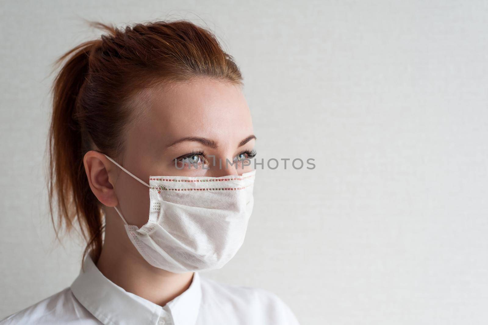 Portrait of a girl in a medical mask. Close up