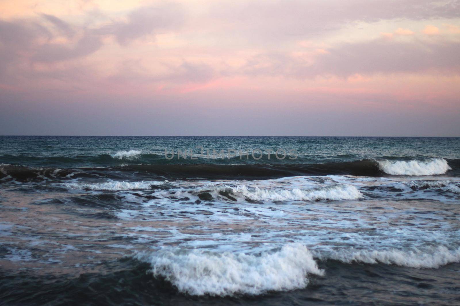 mediterranean sea waves at sunset time. Turkey, Mersin summer beach in evening
