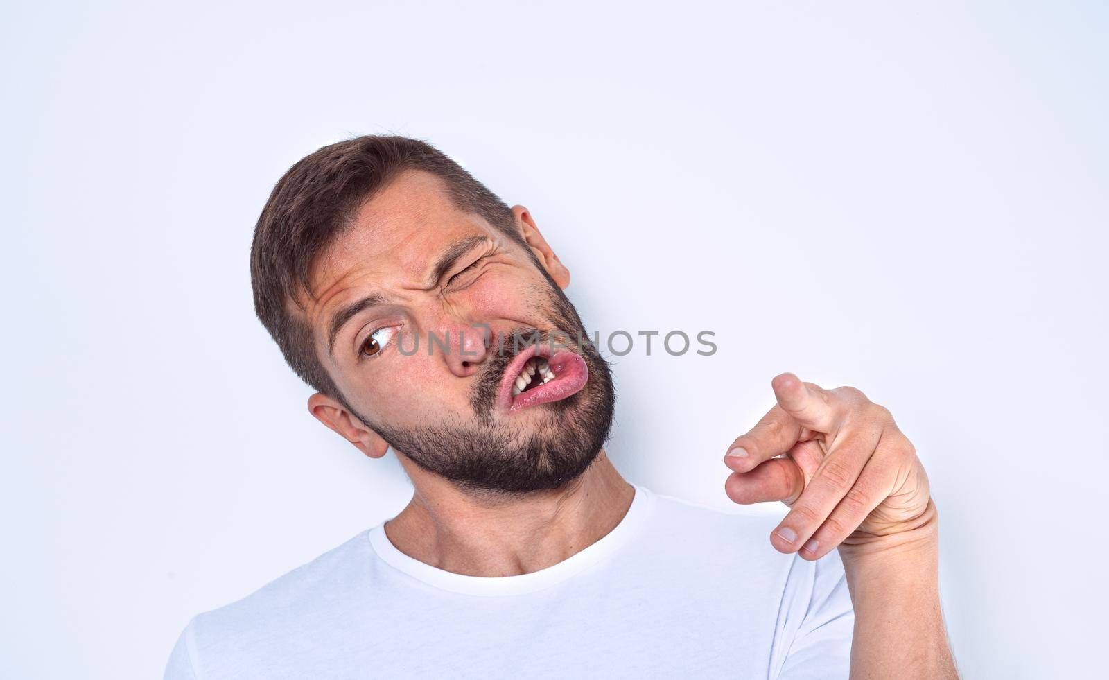 Man with nervous system problem. Man with facial nerve disorder. High quality photo