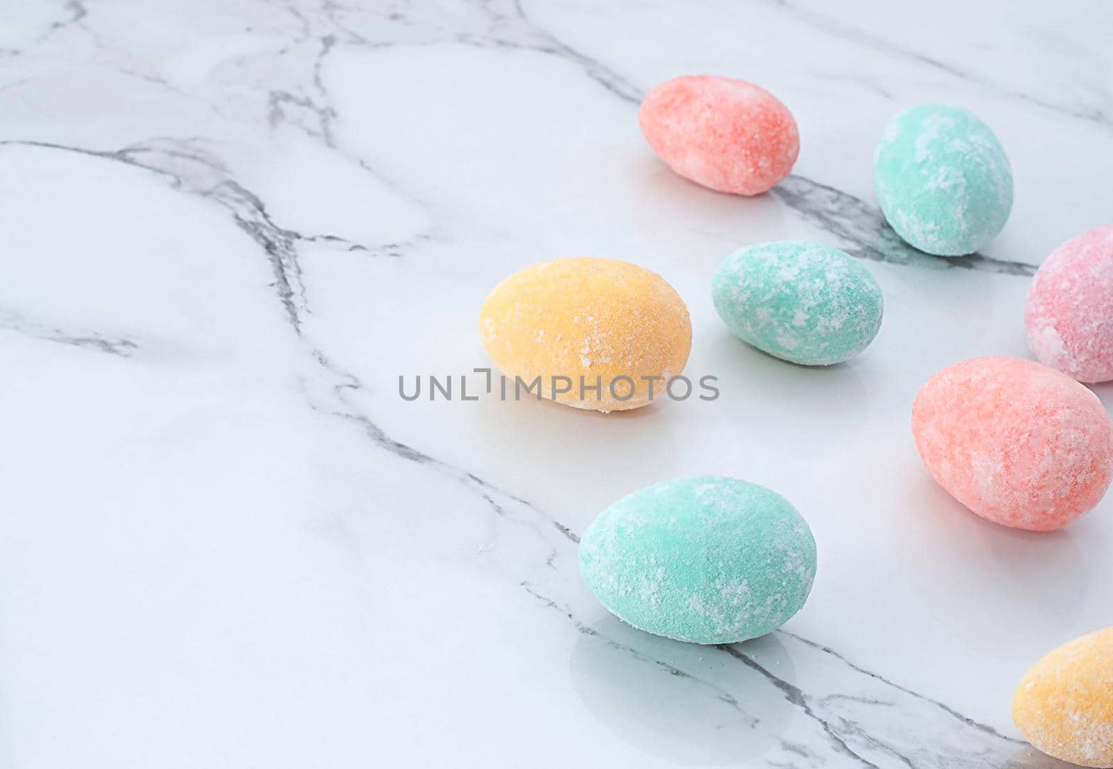 Layout of multi-colored Easter eggs, on a marble table. Soft focus. Close-up. copy space