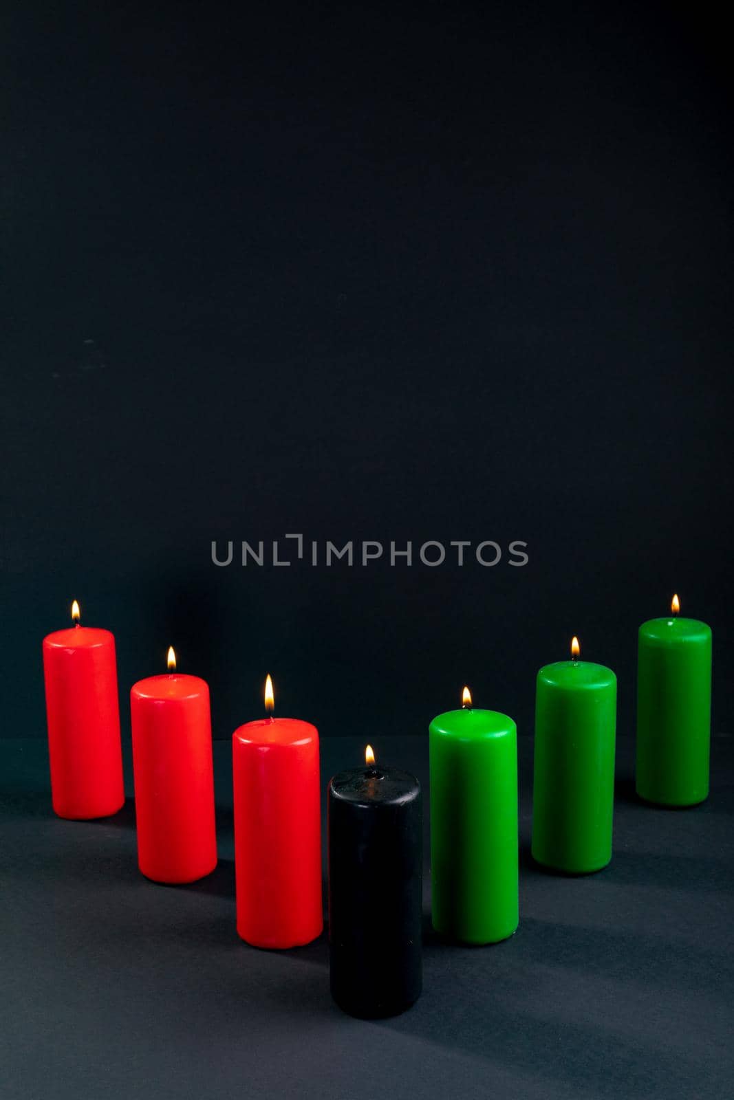 Composition of halloween candles and copy space on black background. horror, fright, halloween tradition and celebration concept digitally generated image.
