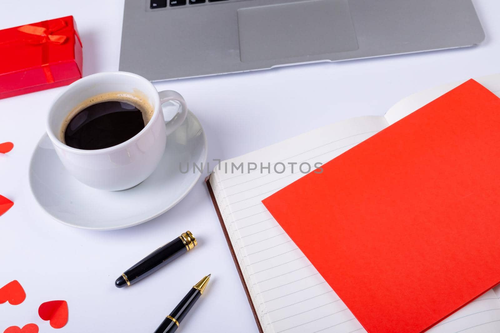 Black coffee and love letter by fountain pen on white background, copy space. valentine's day, drink and love concept.