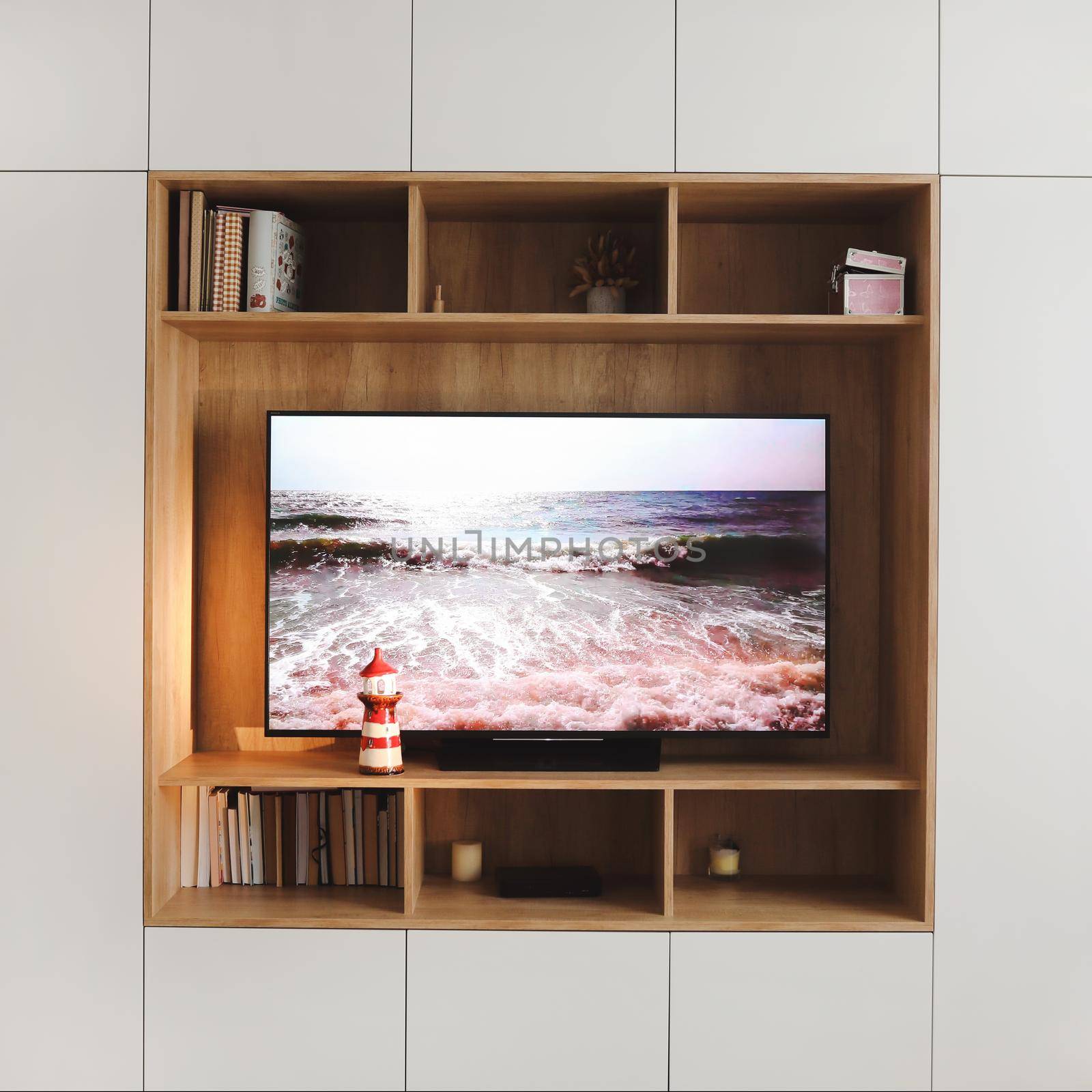 scenic view on TV screen in the living room interior. modern cozy interior design in minimal style