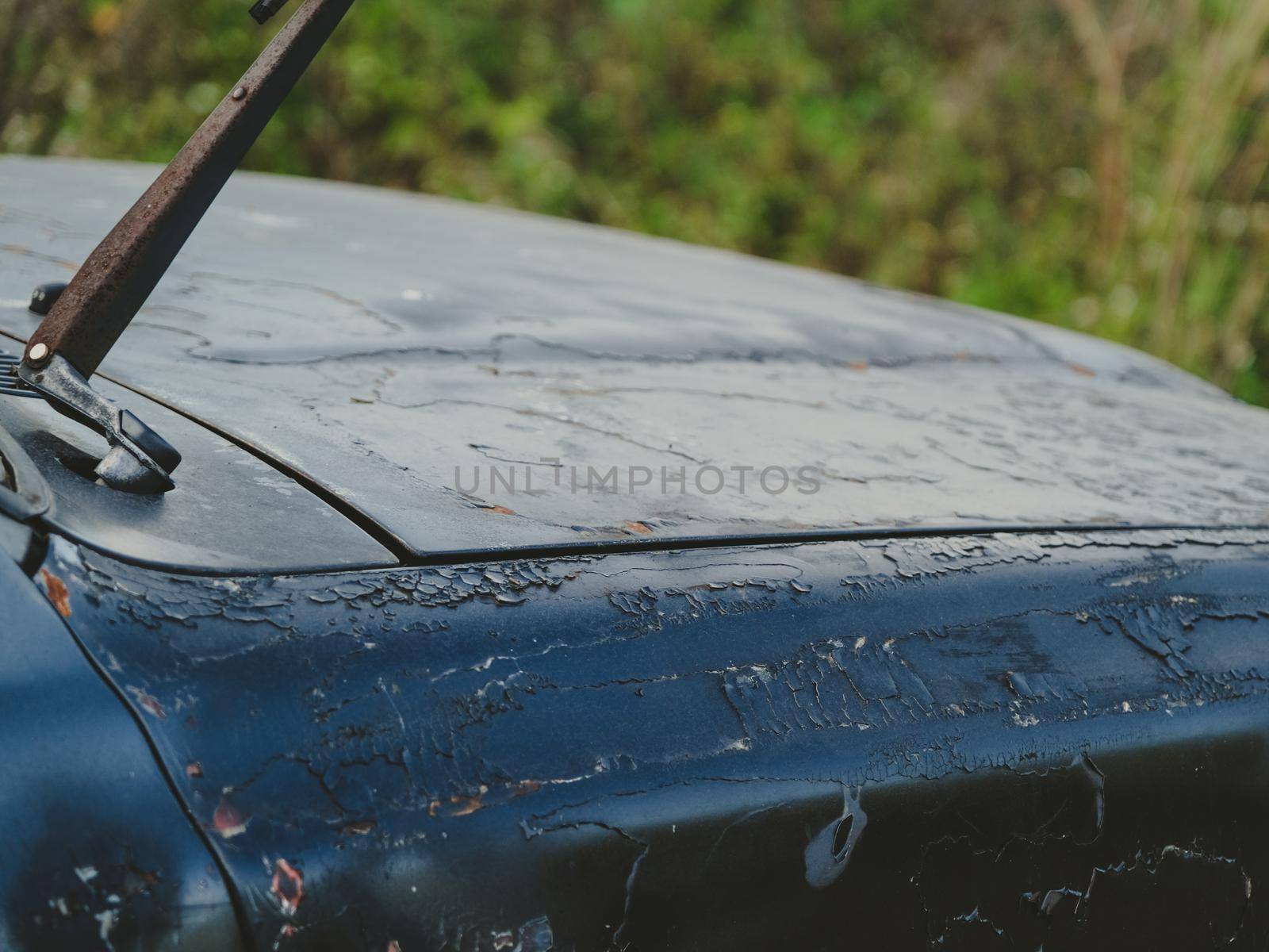 The old car skirt over time until rust. Rust on old ancient car paint rusty steel